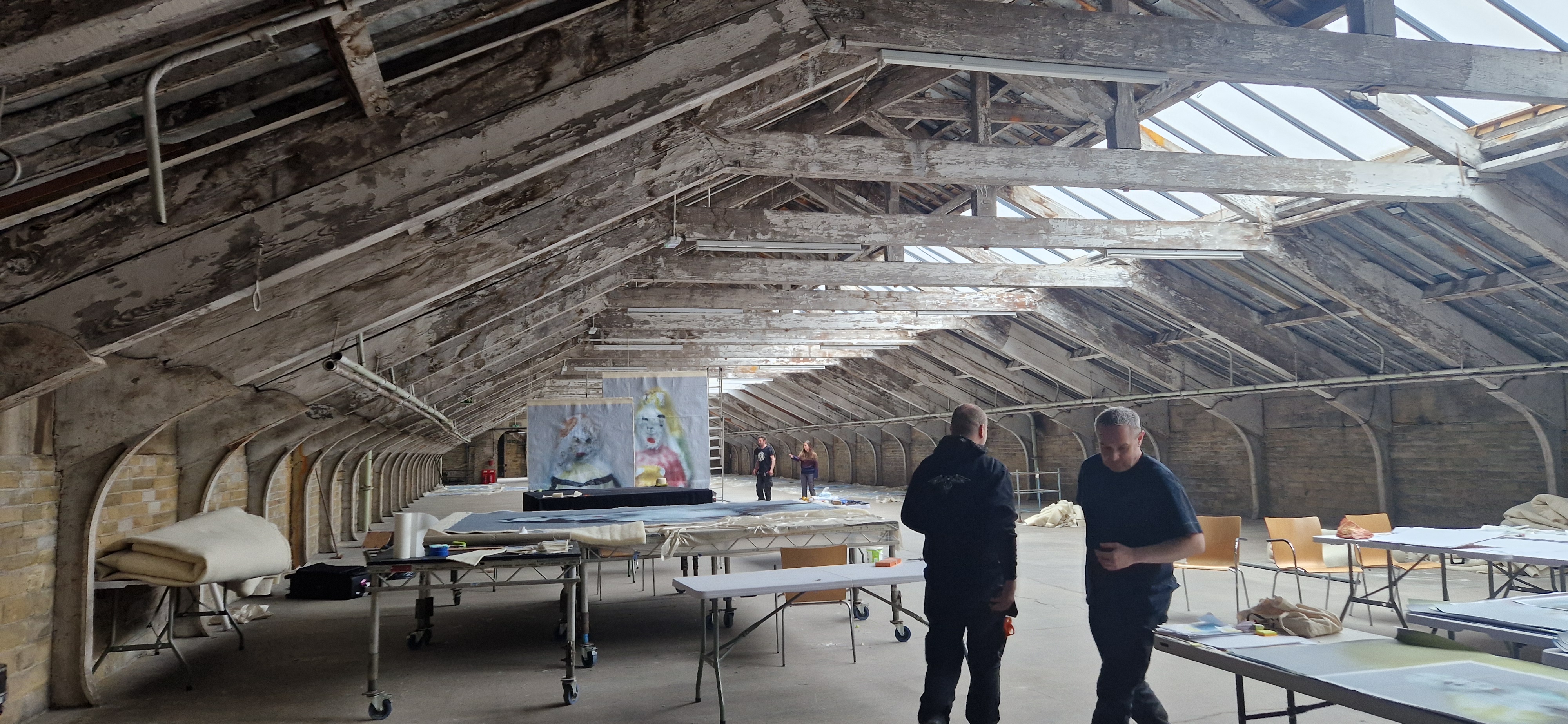 We Will Sing — Raven team working in the venue space during installation, BD25 2025