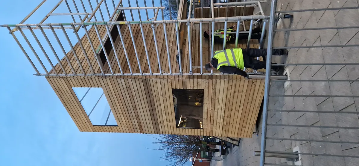 Crew installing quick access tower