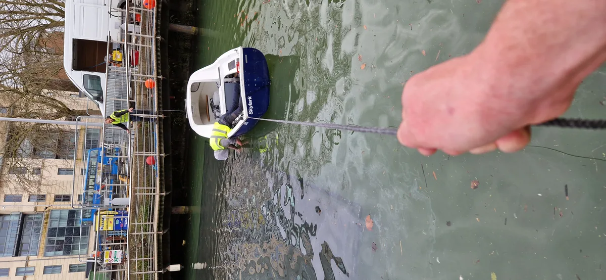 Crew working on waterside Sirens installation