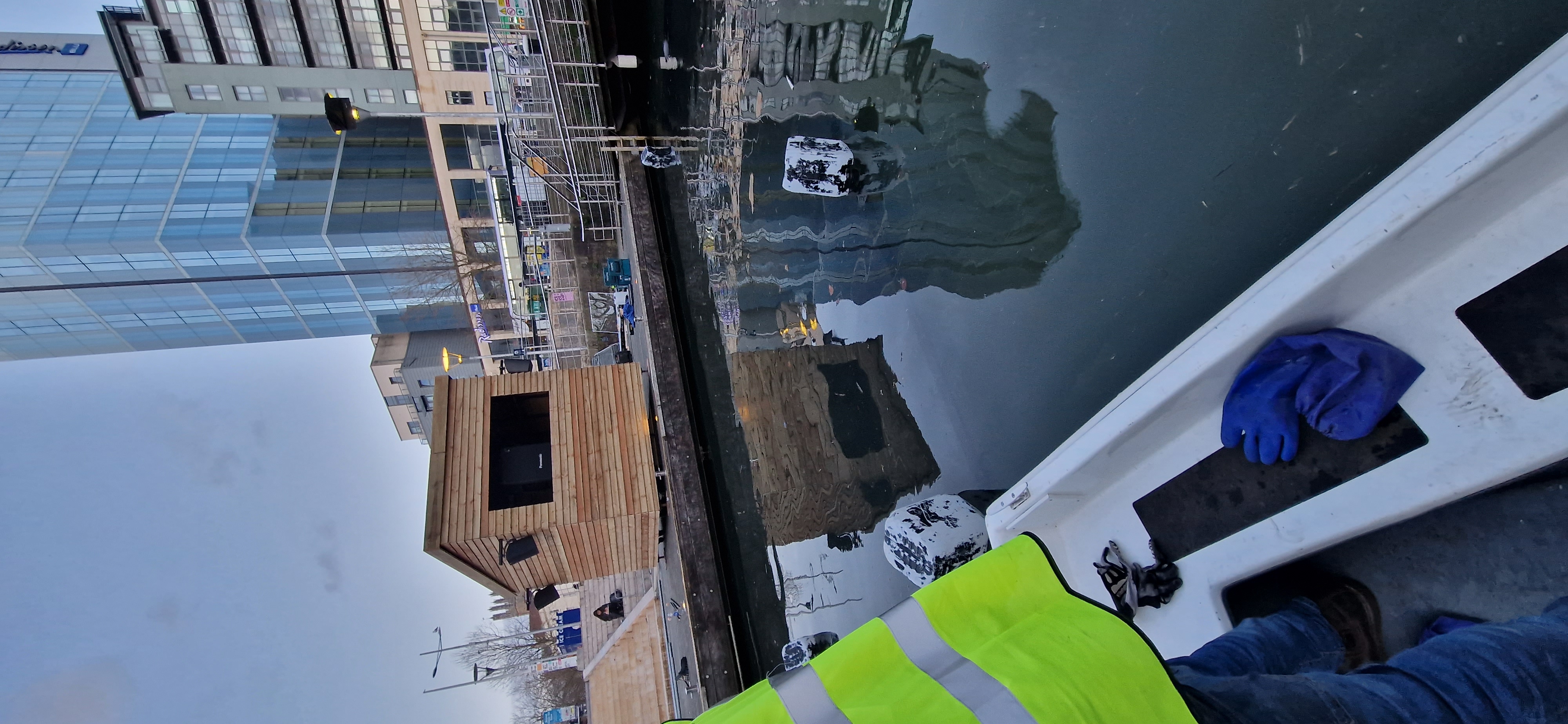 Sirens — rigging the submersible screen from a boat at Salford Quays, LightWaves Festival 2023