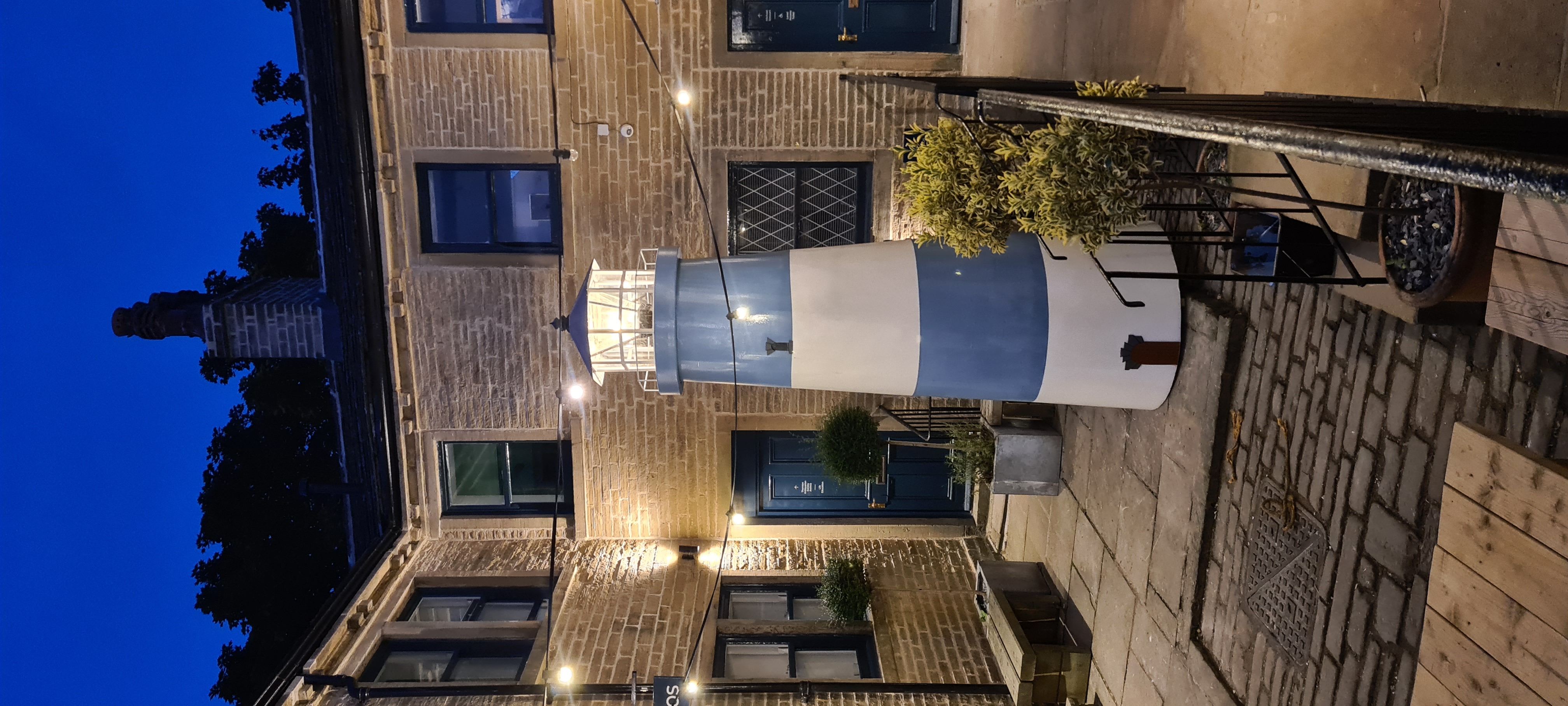 South Square lighthouse — finished installation illuminated at night in the courtyard, Thornton Bradford 2021