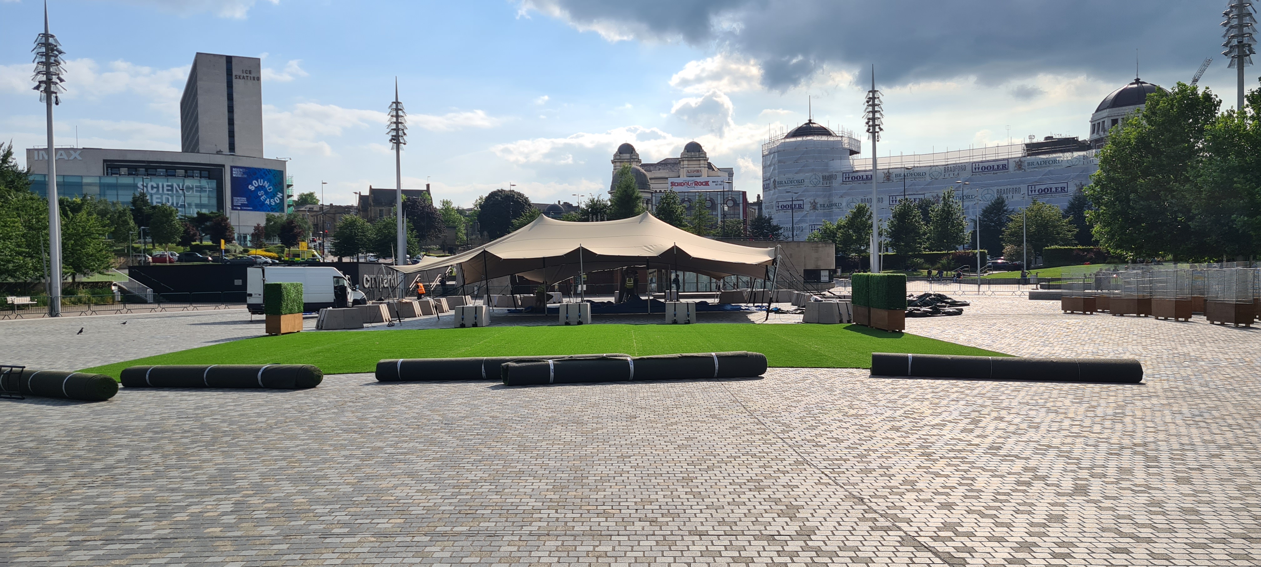Bradford Summer Garden — site setup showing box hedge planters deployed as zone delineation, Bradford city centre